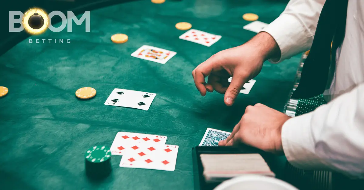 Live poker game at a green felt table featuring cards, chips, and a dealer’s hands – representing online and casino poker in via BoomBetting.